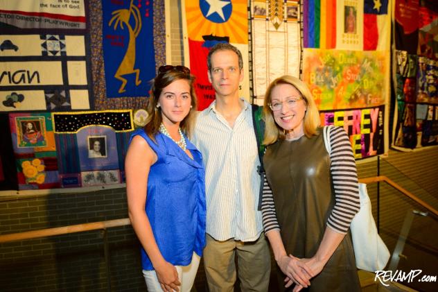 Audience member Daniela Kelley with 'The Normal Heart' cast members Patrick Breen and Patricia Wettig in front of various AIDS quilts lining the stairs at Arena Stage.